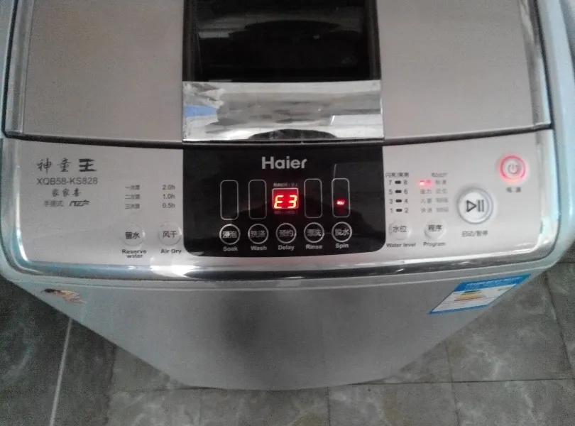 唐山市海尔洗衣机报警时显示代码E0、E1是什么故障？